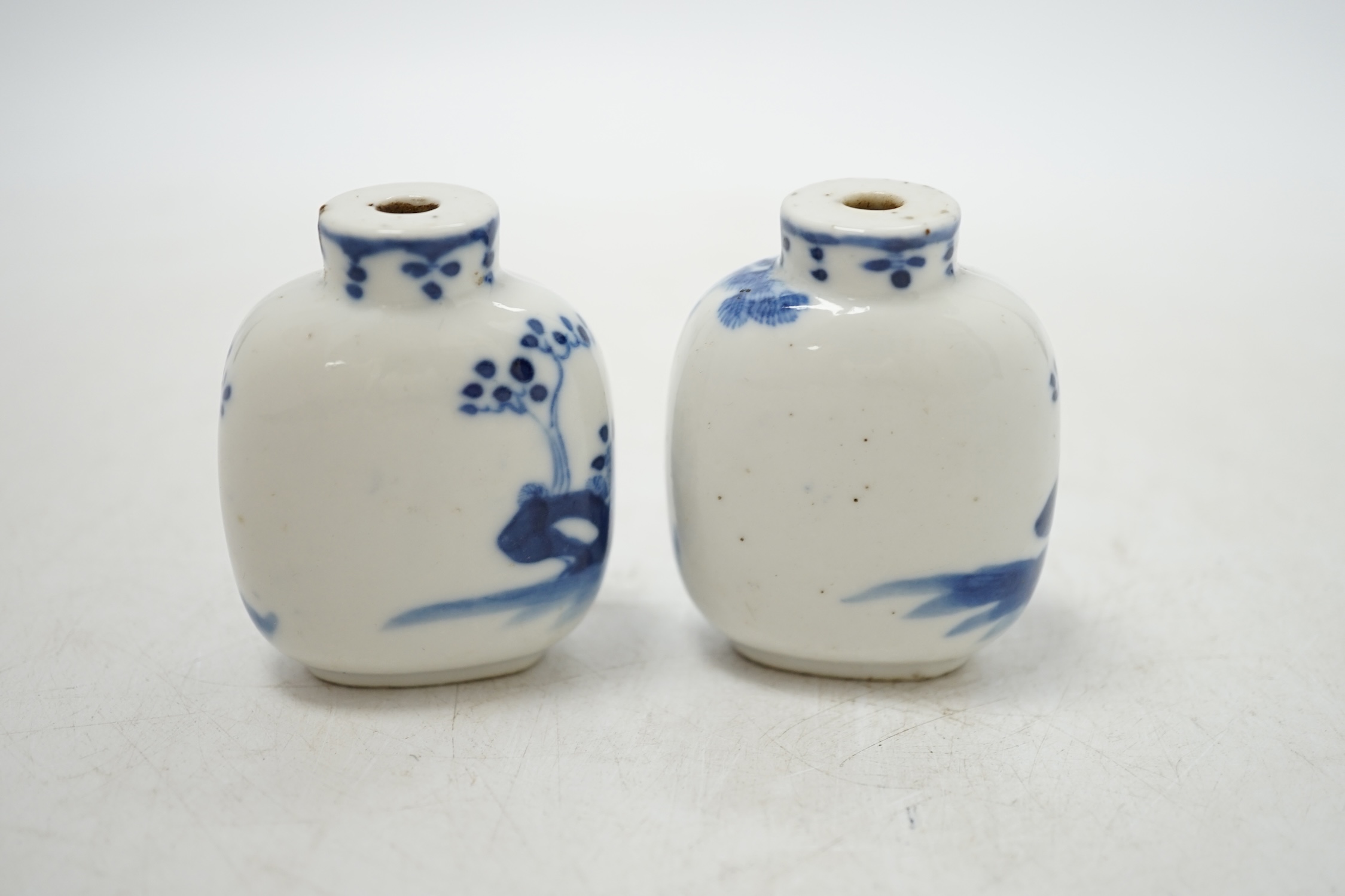 Two Chinese blue and white snuff bottles decorated with figures, largest 6cm high. Condition - fair